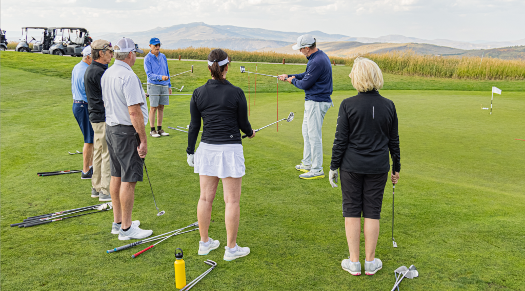 Tim Mahoney leading a group golf school lesson at Cordillera