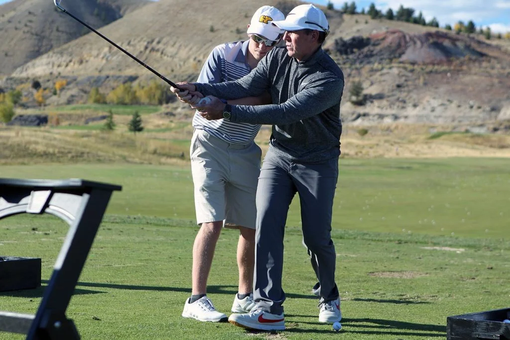 Tim Mahoney coaching a student